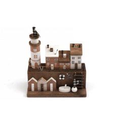 A charming wooden house and beach hut coastal scene with t-light holder.