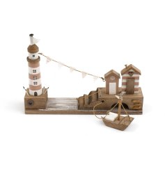 A charming and unique wooden coastal scene featuring a lighthouse, beach huts and a boat. 