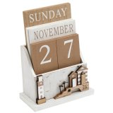 A beach themed wooden desk calendar with charming coastal features and a washed finish. 