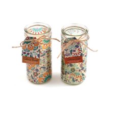 An assortment of 2 citrus scented candles set within summer tile design glass tubes.  