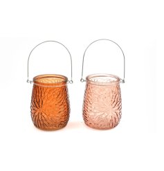 An assortment of 2 richly coloured orange and pink glass lanterns, each with an embossed floral design. 