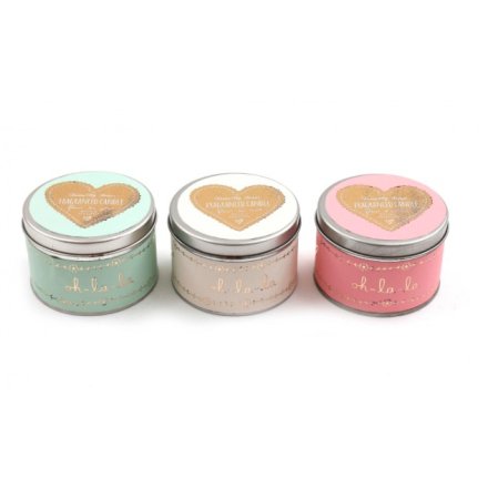 An assortment of 3 fragranced candle tins in stylish pastel colours with oh la la packaging. 