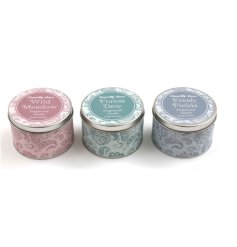 Pink, blue and green candle tins, each with an attractive paisley design. 