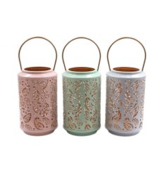An assortment of 3 pretty pastel coloured lanterns, each with a decorative paisley cut out design. 