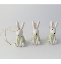 A cute little Easter bunny hanging decoration with charming detailing and patterned dress.