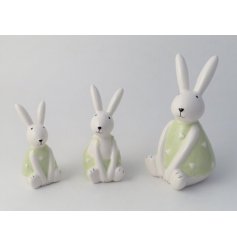 A charming ceramic bunny decoration with a cute smiling face and pointed ears. 