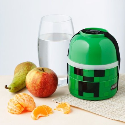 Enjoy lunch on the go with this cool stacking bento box in a green Minecraft creeper design. 