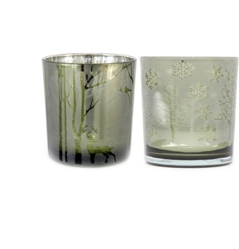 An assortment of 2 glass candle holders in a woodland deer and frosted tree design. 