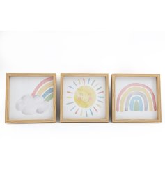 An assortment of 3 colourful sunshine and rainbow framed prints. 