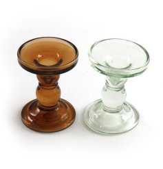 An assortment of 2 chic glass candle sticks in clear and dark honey colours. 