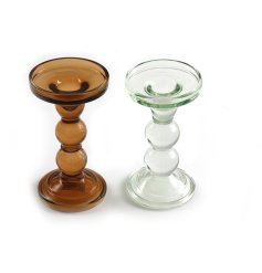 A mix of 2 contemporary glass candle sticks in dark honey and clear colours. A chic interior accessory for the home. 