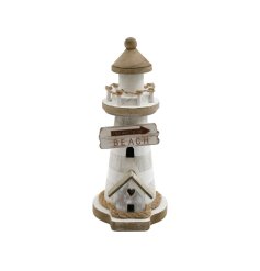 A decorative wooden lighthouse with nautical details