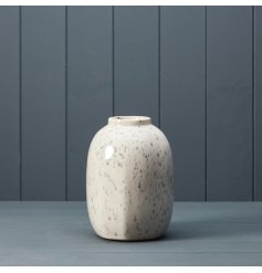 A ceramic vase with speckled pattern.