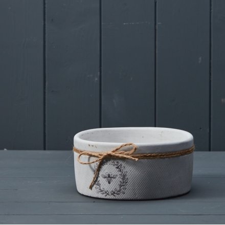A chic bowl / shallow planter with a textured surface pattern and charming bee design. 