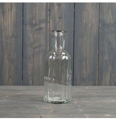 A classic glass bottle with ribbed detailing. A stylish decorative item for the home. 