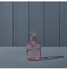 A pretty pink decorative glass bottle.