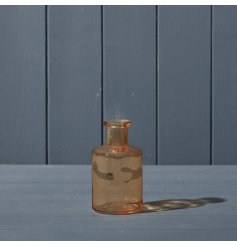 A decorative glass bottle in a beautiful warm cognac shade. 