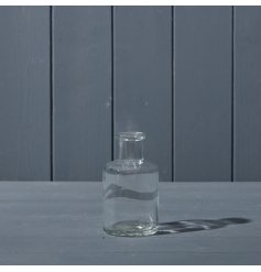 A small clear glass bottle with elongated neck design feature. 