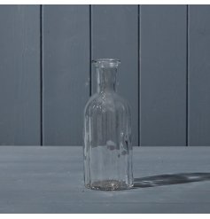  A beautiful clear glass shaped bottle.