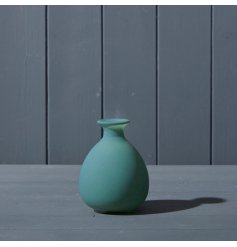 A beautiful glass bud vase in a matte green finish.