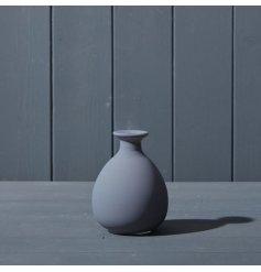 A beautiful matte grey glass bud vase.