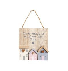 A rustic wooden sign featuring beautifully crafted 3D wooden houses in a range of pastel colours. 