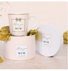 A beautiful mug with pastel pink striped design and "I love you Mum" text with bow charm detail. 