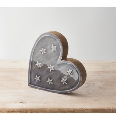A rustic heart shaped ornament made from natural mango wood. Detailed with a dainty star design
