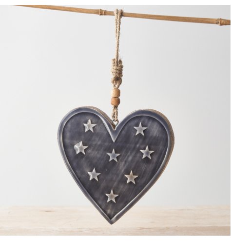 A beautiful mango wood heart decoration with miniature stars and a beaded rope hanger. 