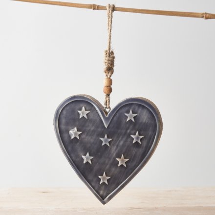 A stylish mango wood heart hanger with a star scattered enamel glaze and chunky rope hanger.