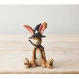 A charming resin bunny. Beautifully detailed with a black bow and a witches hat. 
