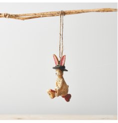 A charming and unique resin bunny sat on a broomstick with a witches hat. A beautifully detailed hanging decoration. 