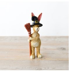 A rabbit decoration with Halloween themed details including witches hat and broom!
