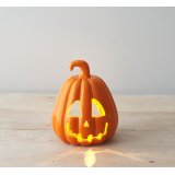A fabulous ceramic pumpkin t-light holder with a rich orange glaze and spooky carved face. 