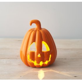 A chic ceramic pumpkin decoration with a glossy finish. 