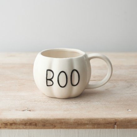 A unique pumpkin shaped mug with a glossy white finish and embossed BOO slogan. 