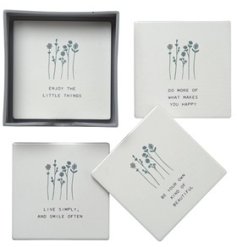 A set of 4 coasters, each with a simple wildflower illustration and heart warming message.  
