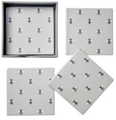 A set of 4 beautiful bee patterned coasters on a stylish grey background.