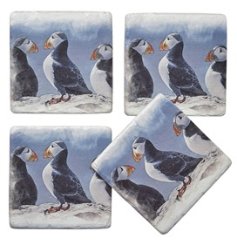 A delightful set of 4 coasters each with a print of 3 adorable puffins on. 