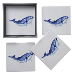 A set of 4 matching coasters, each with a majestic whale print on the front. 