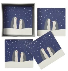 A set of 4 matching penguin design coasters featuring cute penguins in a snowy scene! 