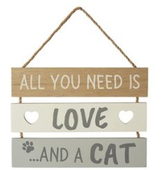 A decorative wooden slatted sign with "all you need is love and a cat" text with paw print and heart cut out details. 