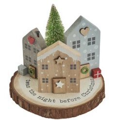 A delightful wooden Christmas village scene featuring 3D houses, Christmas quote and tree. 