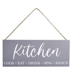 A simple and stylish hanging wooden sign featuring "kitchen cook, eat, drink, sing, dance" message. 