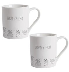 An assortment of 2 white ceramic mugs, each with simple plant illustrations and written message. 
