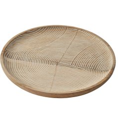 A large, chunky dish with a natural carved design. A stunning interior accessory, ideal for display on coffee tables. 