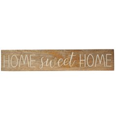 A rustic wooden sign with a carved Home Sweet Home slogan. 