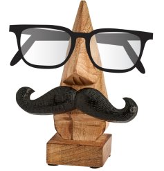 A quirky glasses stand made from chiseled wood.
