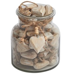 A small jar of wooden hearts, perfect for handing out as tokens for weddings and events.