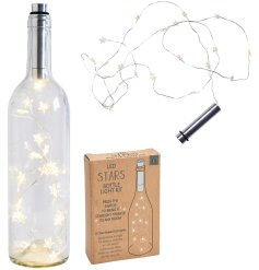 A string of star shaped led lights with a bottle stopper style top to create a bottle display. 